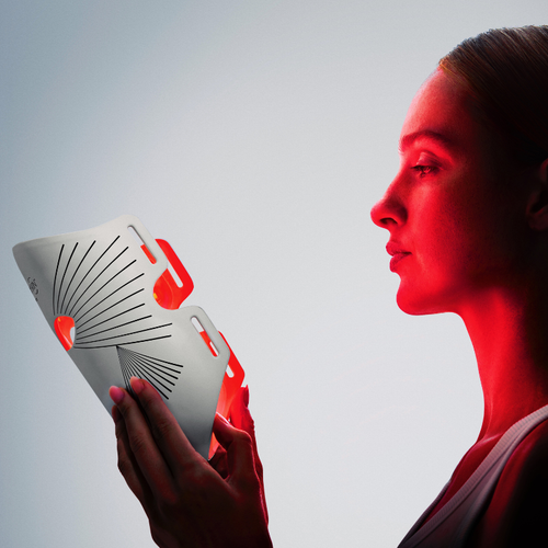 Woman glowing using an led face mask